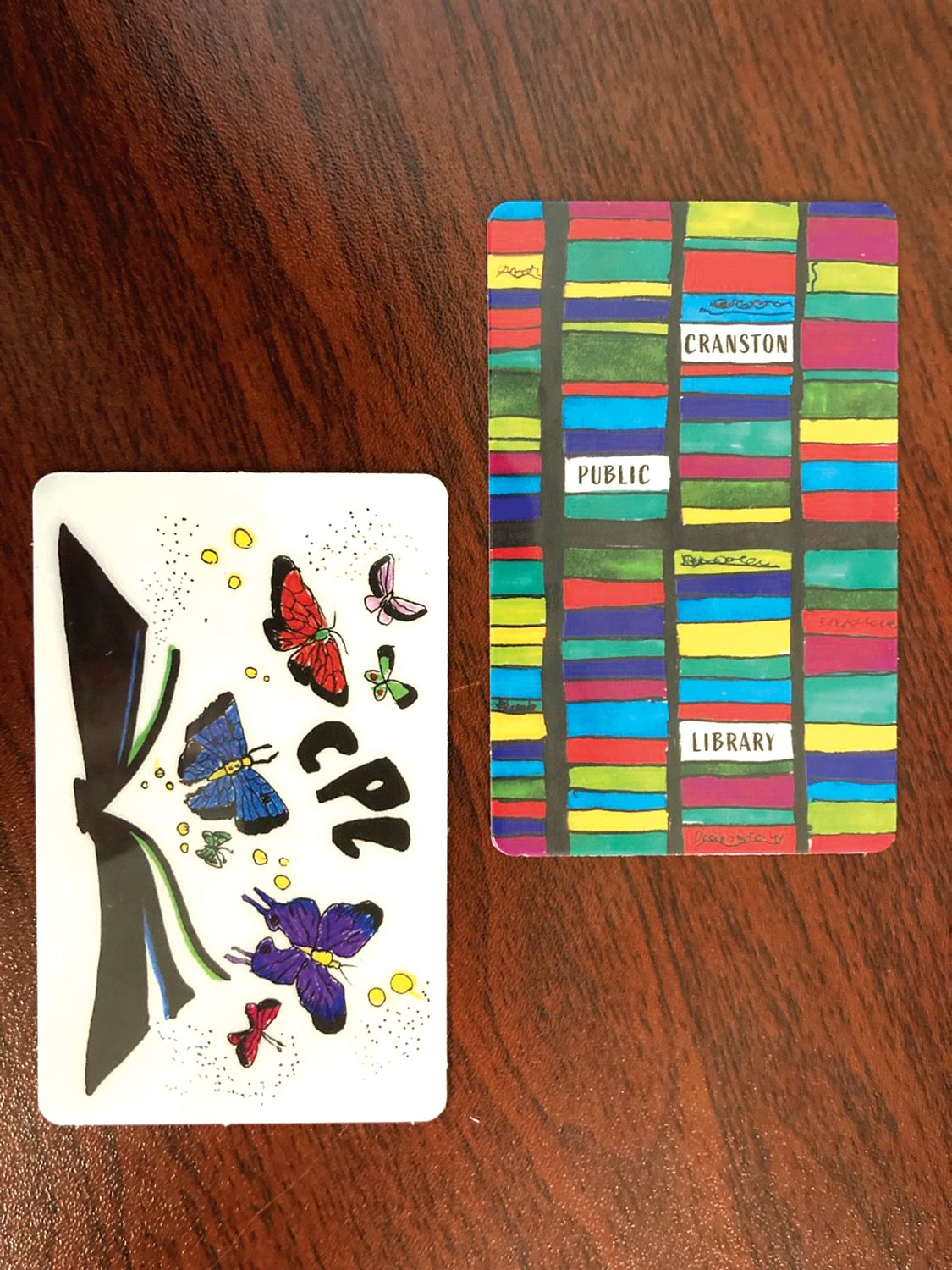 NEW DESIGNS: Library patrons now have the option of two new library cards, which were designed by Norah Kusz and Zachary Leone in CPL’s Library Card Design Contest that was hosted in September.